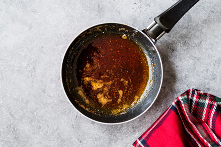 Preparing Red Sauce with Frying Melted Butter and Spices in Pan / Cooking Recipe. Homemade Organic Food.の写真素材