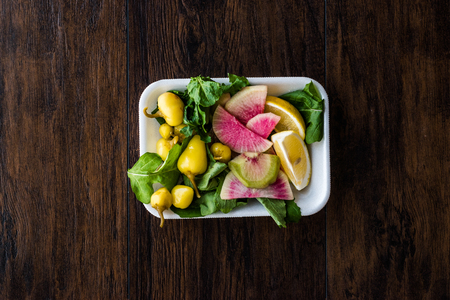 Package of Salad with Turkish Pickle, Radish, Parsley and Lemon in Plastic Box Container. Organic Food.の写真素材