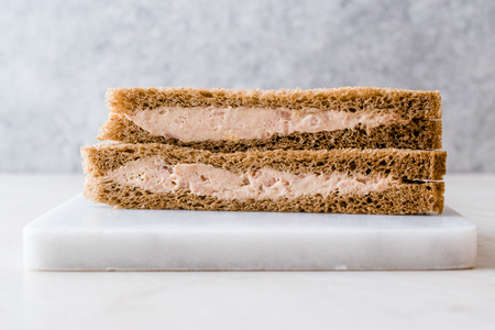 Triangle Light Sandwich with Tuna Fish Paste on Marble Board. Fast food.の写真素材