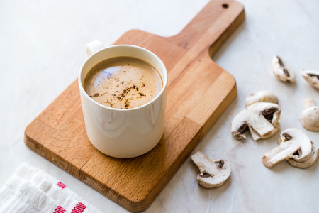 Mushroom Latte Coffee with Milk and Espresso on Wooden Board Ready to Drink. Hot Beverageの写真素材