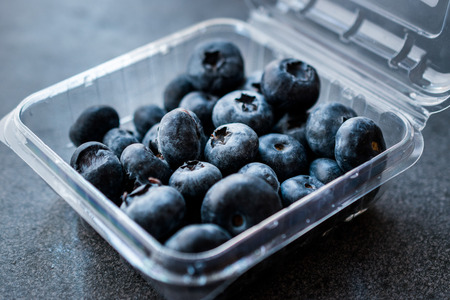 Blueberries / Fresh Raw Organic Berries Blueberry in Plastic Box Package or Container Ready to Eat.