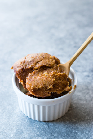 Japanese Miso Paste with Wooden Spoon. Traditional Organic Food.
