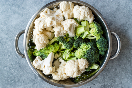 Organic Raw Cauliflower and Broccoli in Metal Colander. Organic Food.の写真素材