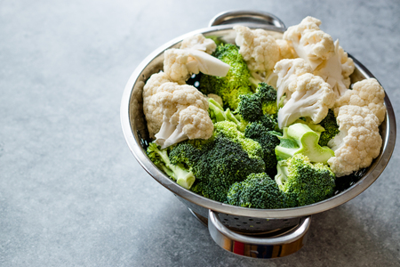 Organic Raw Cauliflower and Broccoli in Metal Colander. Organic Food.の写真素材