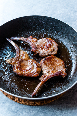 Fried Lamb Chops in Pan. Grilled and Sauteed. Organic Meat Food.