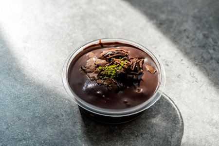 Profiteroles with Pistachio in Plastic Cup / Package. Traditional Organic Food.の写真素材