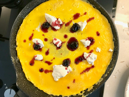 Blackberry Jam Omelette with Cream Cheese in Pan Ready to Eat in Breakfast.の写真素材