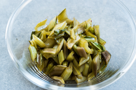 Marinated Chard Root Pickles Cut Diagonal  in Glass Bowl. Organic Food.の写真素材