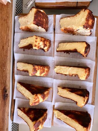 San Sebastian Cheesecake Slices on Tray / Creamy Plain Spain Style. Traditional Dessert.の写真素材
