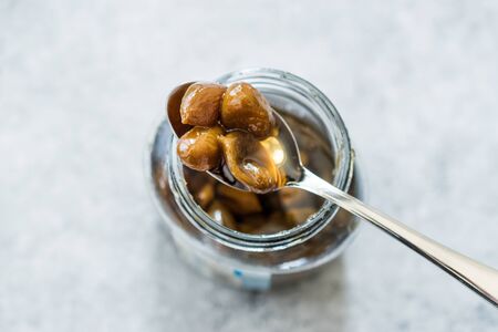 Pistachio Jam with Spoon in Jar / Marmalade. Organic Food For Breakfast.の写真素材