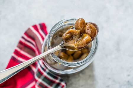 Pistachio Jam with Spoon in Jar / Marmalade. Organic Food For Breakfast.の写真素材