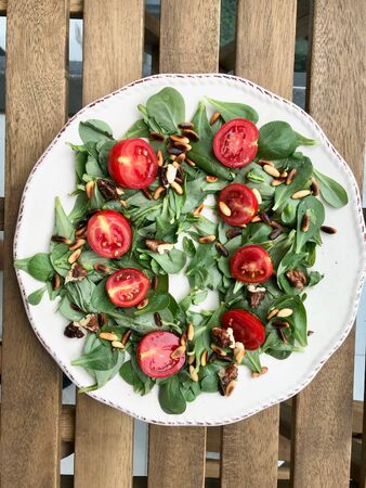 Purslane Salad with Walnut, Pine Nuts, Cherry Tomatoes and Olive Oil. Organic Fresh Food.の写真素材