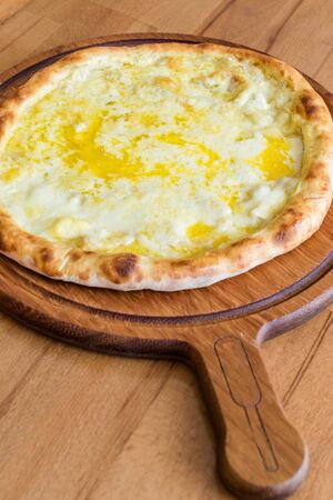 Traditional Turkish Pide at Kebab Restaurant on Wooden Table. Turkish Pizza.の写真素材