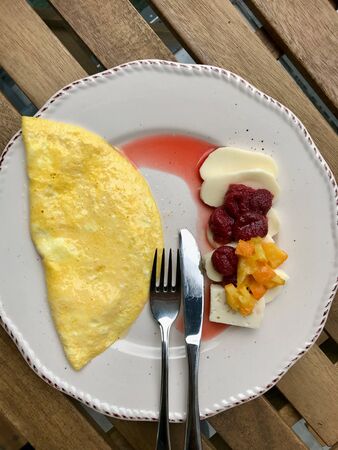 Folded Omelette with Goat Cheese, Strawberry and Orange Jam / Marmalade for Breakfast. Organic Food.