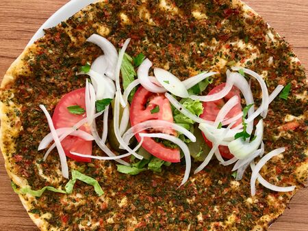 Lahmacun Turkish Traditional Pizza with Minced or Lamb Meat, Onions and Tomatoes. Fast Food.