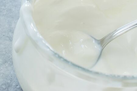 Homemade Goat Yogurt in Glass Bowl with Spoon / Probiotic Custard. Organic Product.の写真素材