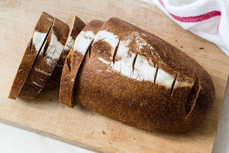 Einkorn Wheat Bread with Slices on Wooden Board. Organic Food.