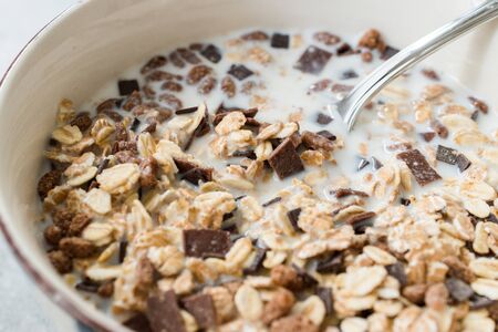 Muesli Granola with Bitter Chocolate Pieces in Milk for Breakfast.