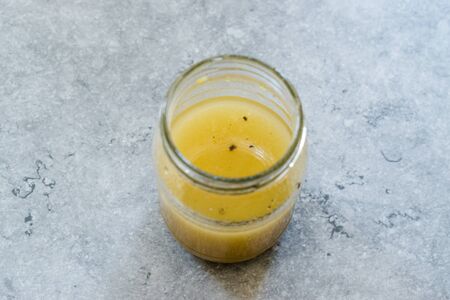 Salad Dressing Mustard Sauce in Glass Bowl Ready to Use. Organic Food.