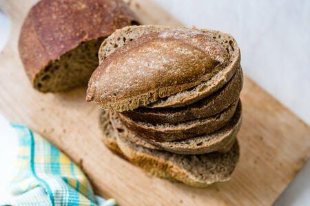 Ciabatta Sourdough Bread with Olive Oil on Wooden Board. Organic Bakery Food.