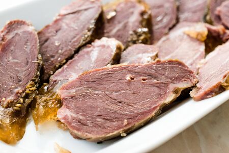 Smoked Meat Veal Cheek Slices on Wooden Board. Ready to Eat. Organic Food.の写真素材