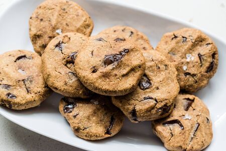 Paleo Chocolate Chip Cookies Made with Coconut and Almond Flour on Baking Sheet / Paper. Organic...