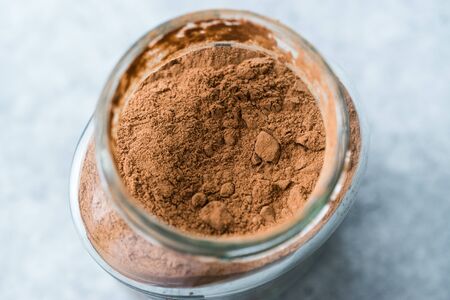 Carob Powder and Pods Ready to Use in Jar. Organic Food.