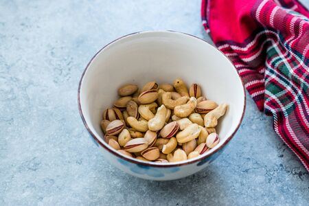 Cashew and Siirt Pistachios in Ceramic Bowl. Healthy Organic Snacks Ready to Eat.