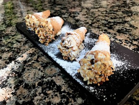 Sicilian Sweets Cannoli with Ricotta Cheese from Italy. Traditional Dessert.
