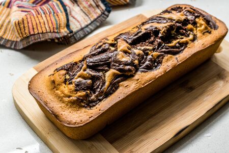Whole Marble Cake on Wooden Board. Ready to Serve. Traditional Dessert.