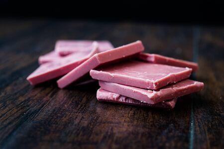 Ruby Chocolate Pieces. New Type of Processing Cocoa Beans.  Sweet Snacks.