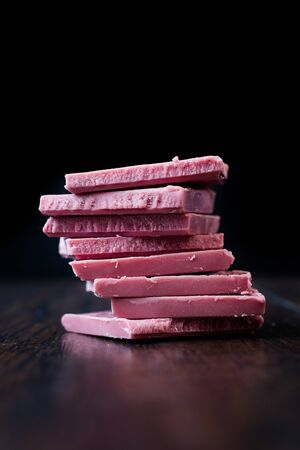 Ruby Chocolate Pieces. New Type of Processing Cocoa Beans.  Sweet Snacks.