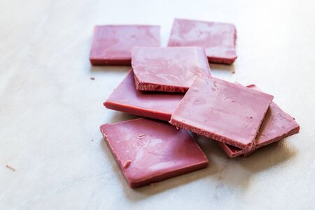 Ruby Chocolate Pieces. New Type of Processing Cocoa Beans.  Sweet Snacks.