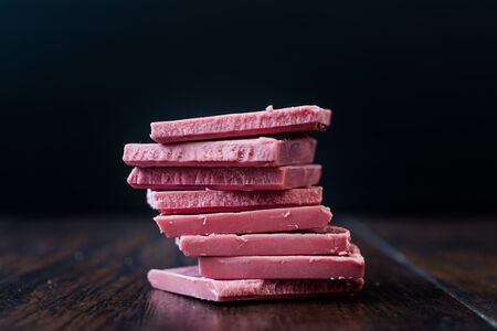 Ruby Chocolate Pieces. New Type of Processing Cocoa Beans.  Sweet Snacks.