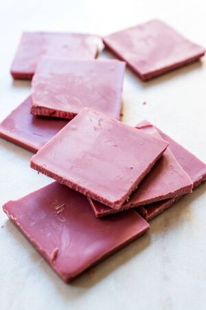 Ruby Chocolate Pieces. New Type of Processing Cocoa Beans.  Sweet Snacks.