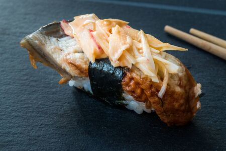 Unagi Nigiri Sushi with Ginger, Wasabi, Soy Sauce and Chopsticks. Traditional Organic Food.の写真素材