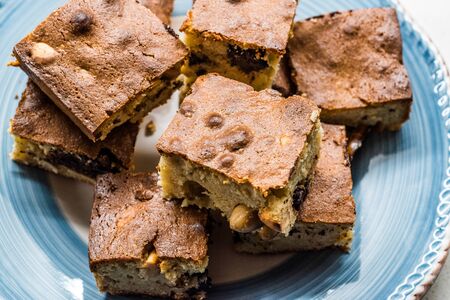 Blondie Brownie with Peanut Butter, White Chocolate and Roasted Peanuts. Homemade Cake Dessert /...