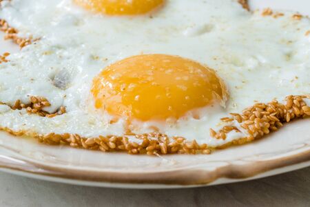 Sesame Seeds with Fried Eggs for Breakfast. Organic Food.