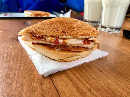 Turkish Utu Tost / Toast Sandwich on Wooden Table Surface. Street Food. Street Food.