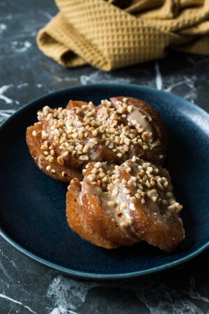 Turkish Dessert Hayrabolu with Sherbet, Tahin, Cheese and Hazelnut Powder. Traditional Dessert.の写真素材