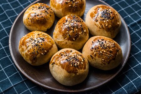 Homemade Turkish Pastries Pogaca with Black Cumin and Sesame Seeds. Traditional Organic Food.