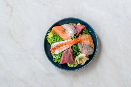 Sashimi Salad with Wakame, Seaweed, Salmon, Sea Bass, Shrimp, Kani, Mackerel Fish, Tuna served with Chopsticks. Traditional Organic Food.の写真素材