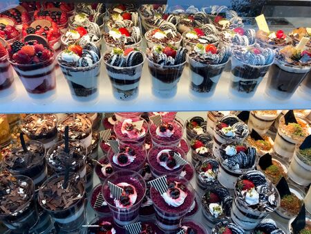 Pudding Yogurt with Fruits / Yoghurt at Patisserie Showcase Street Food Dessert. Healthy Dessert.