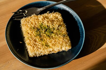 Turkish Dessert Custard Pudding Muhallebi Kadayif with Pistachio Powder. Traditional Dessert.の写真素材