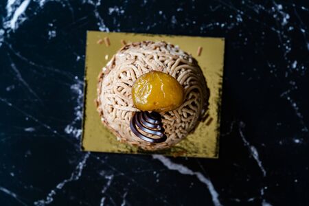 French Traditional Cake "Mont Blanc" with Chestnuts Cream / Chestnut served with Black Plate.の写真素材