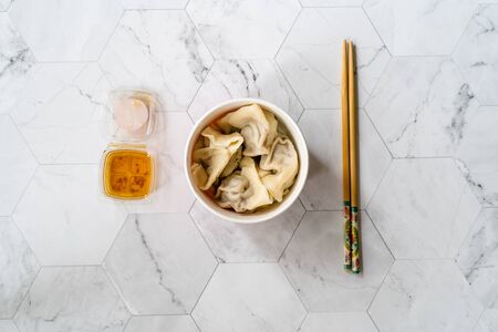 Take Away Japanese Food Steamed Dumplings with Garlic Sauce in Plastic Box Package / Container. Ready to Eat.の写真素材