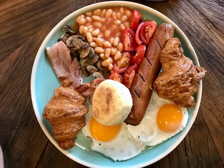Full English Breakfast including Sausages, Grilled tomatoes and Mushrooms, Egg, Bacon, Baked Beans...