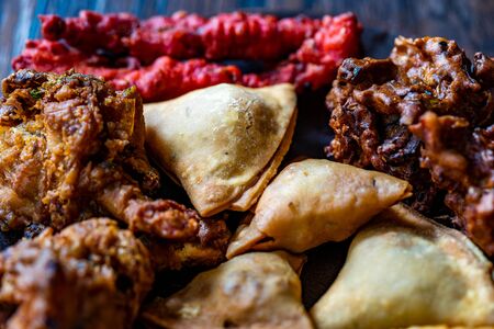 Indian Asian Food Samosas / Samsa with Pakora, Aloo Tikki and Spring Rolls. Traditional Food.