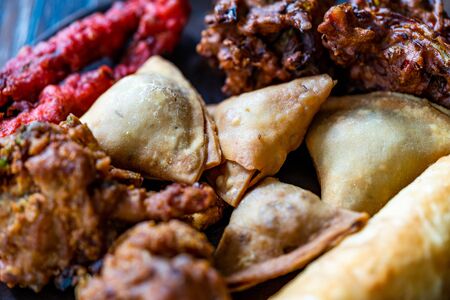 Indian Asian Food Samosas / Samsa with Pakora, Aloo Tikki and Spring Rolls. Traditional Food.