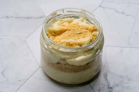 Homemade Custard Banana Pudding with Baby Biscuit Powder. Turkish Magnolia Dessert in Glass Bowl. Organic Healthy Dessert.の写真素材